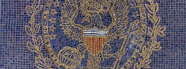 mosaic GU seal at the entrance to Healy Hall