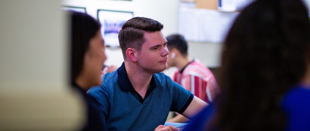 students sitting around a table talking